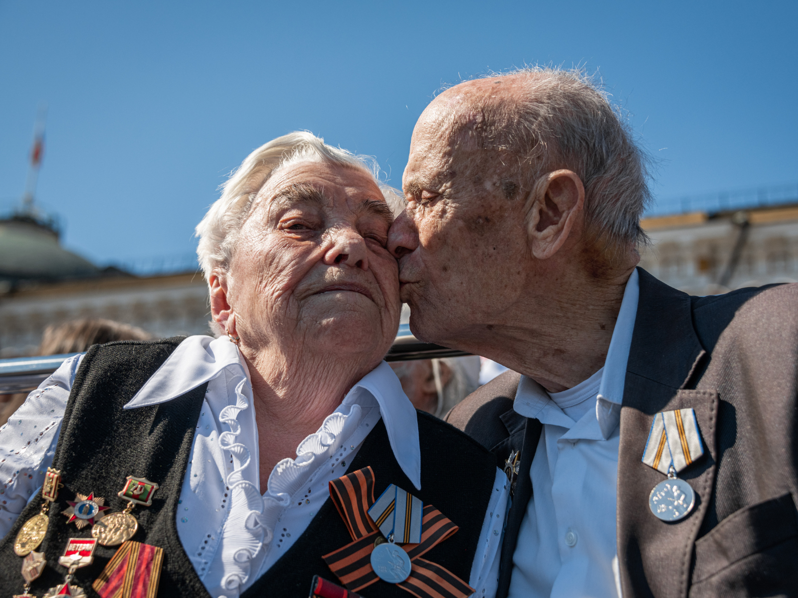 Elderly couple kissing