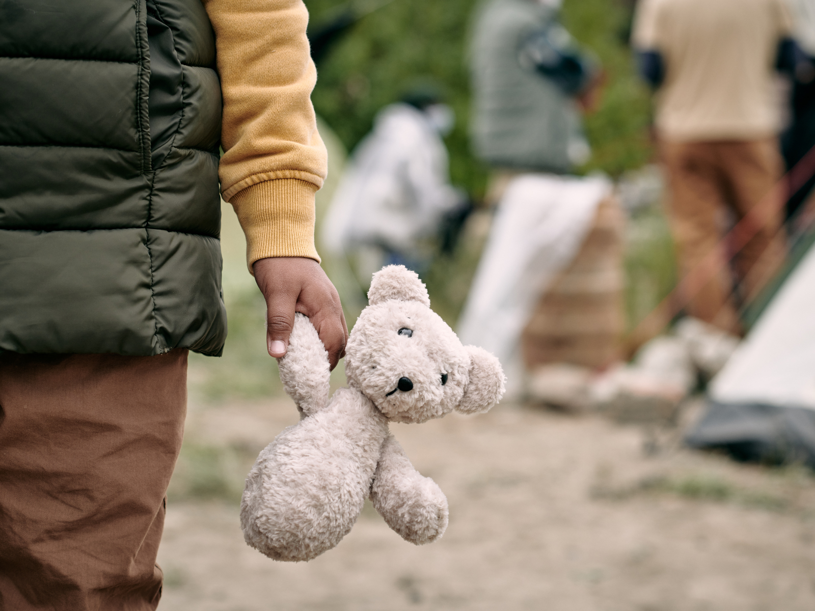Child holding teddy bear